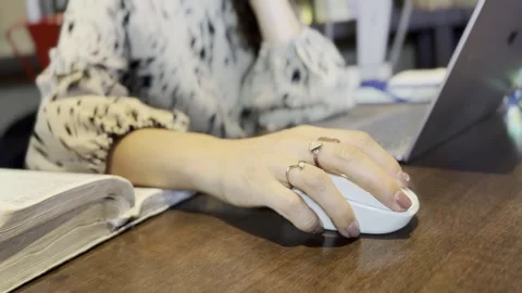 Close-Up: Asian Woman’s Hand Controlling Mouse in Coffee Shop Stock Footage 253836982