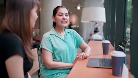 Close-up of Asians researching, talking, sharing ideas, communicating, searching Stock Footage 265766595