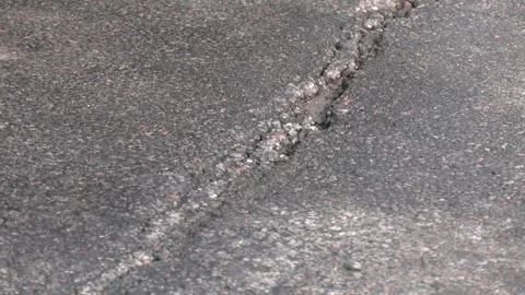 Close-up asphalt road with large long crack Video stock 249923506