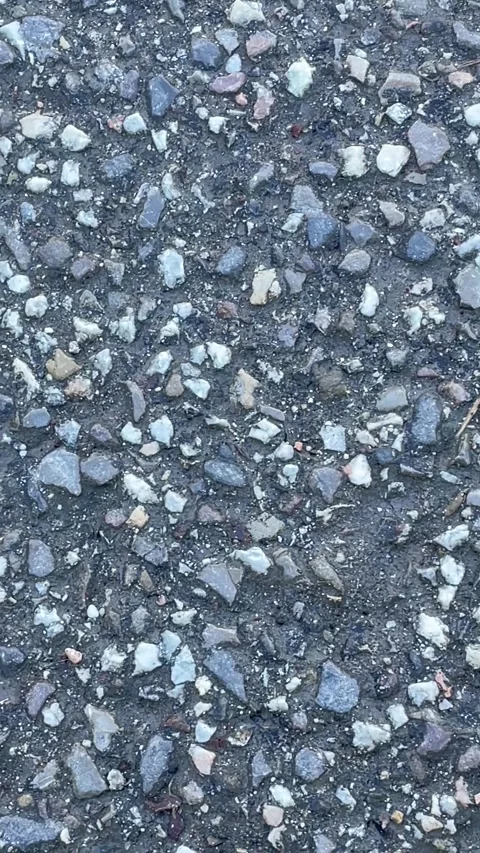 Close-up asphalt road texture with small stones Stock Footage 327770291