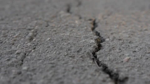 Close-up of asphalt texture with deep cracks. Stock Footage 287416566
