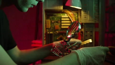 Close-up of assembling motherboard, fixing computer details with magnifying Stock Footage 158928742