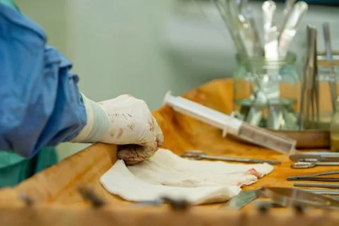 Close-up of the assistant surgeon's hand. Stock Photos