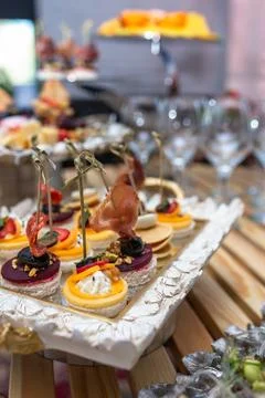 Close-up of assorted canapes on the buffet table Stock Photos