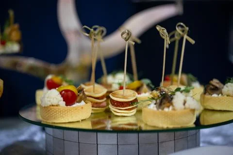 Close-up of assorted canapes on a glass surface Stock Photos