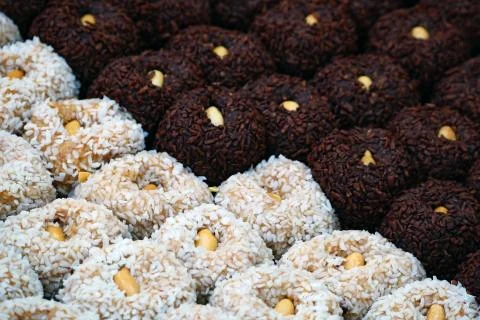 Close-up assorted candies on the table. Luxury handmade sweets. Vegan tasty Stock Photos