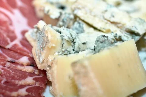 Close-up of assorted cheese and cured meat slices served on a platter Stock Photos