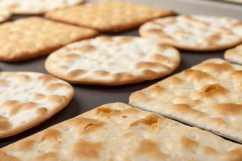 Close up of assorted crackers on a baking tray Stock Photos