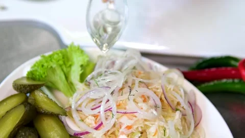 Close up of assorted pickled tomatoes cucumbers and sauerkraut with red onion Stock Footage 319187092