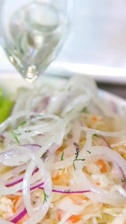 Close up of assorted pickled tomatoes cucumbers and sauerkraut with red onion Stock Footage 320724267