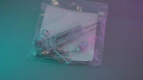 Close-up of assorted rear drum brake hardware neatly packed in a plastic bag Stock Footage 340961396
