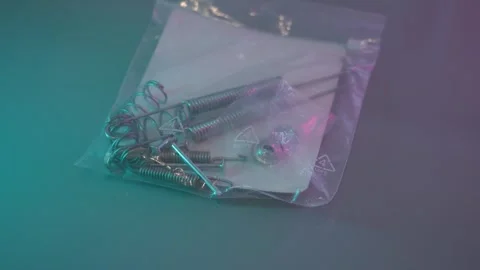 Close-up of assorted rear drum brake hardware neatly packed in a plastic bag Stock Footage 340961434