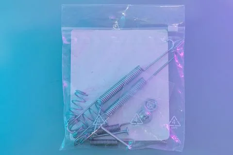 Close-up of assorted rear drum brake hardware neatly packed in a plastic bag Stock Photos