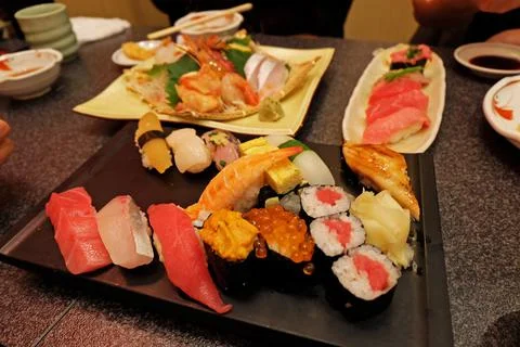 Close up assorted Sushi rolls and Sashimi Stock Photos