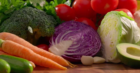 Close-up assortment of fresh vegetables including tomatoes cauliflower bell Stock Footage 311893011
