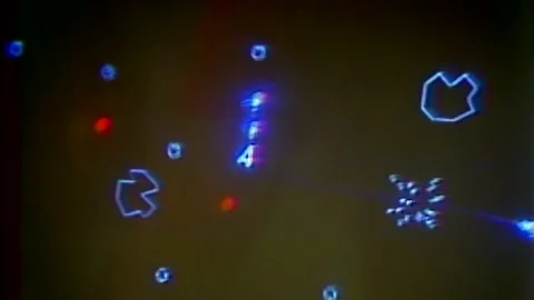 CLOSE UP OF ASTEROIDS ARCADE GAME BEING PLAYED Stock Footage 200079147