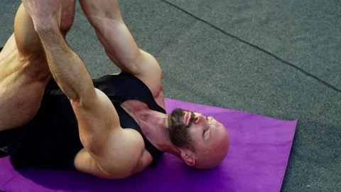 Close-up of an athlete stretching the back of his legs. Stock Footage 247247587