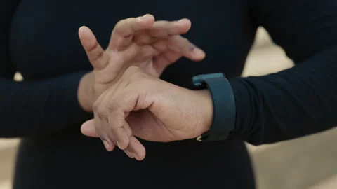 Close-Up of an Athletes Hand Adjusting a Digital Smart Watch Before Run. 库存影片 307612911