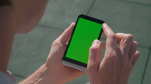 Close up of Athletic mans hands holding smartphone with green screen chroma key. Stock Footage 95232108