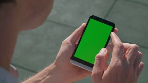Close up of Athletic mans hands holding smartphone with green screen chroma key. Stock Footage 95232138