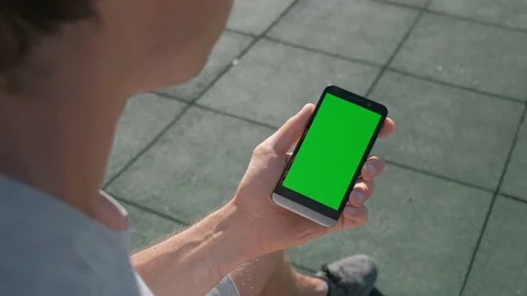 Close up of Athletic mans hands holding smartphone with green screen chroma key. Stock Footage 95232192