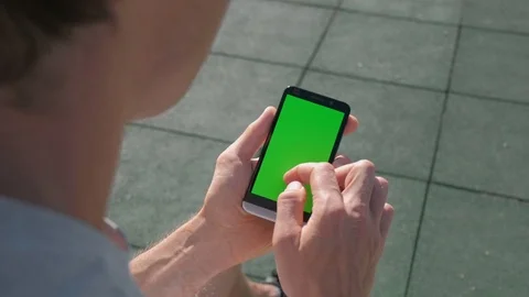 Close up of Athletic mans hands holding smartphone with green screen chroma key. Stock Footage 95232274