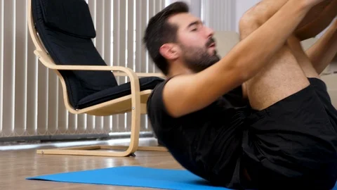 Close up of an athletic young man doing crunches Stock Footage 95638910