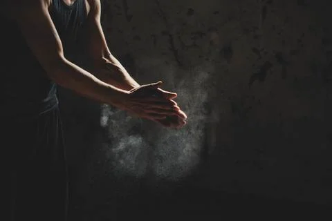 Close Up Of Athletic Young Man Hands While Exercise In Old Factory Building Foto stock