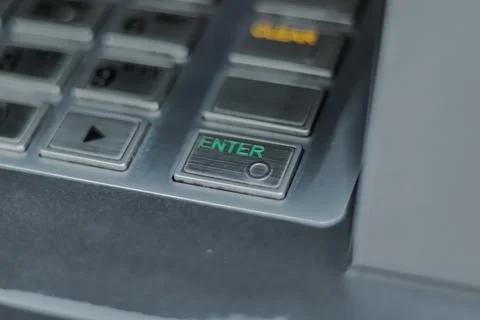 Close-up of ATM Keypad with 'Enter' Button Pressed, Showing Metallic Textur.. Stock-Fotos