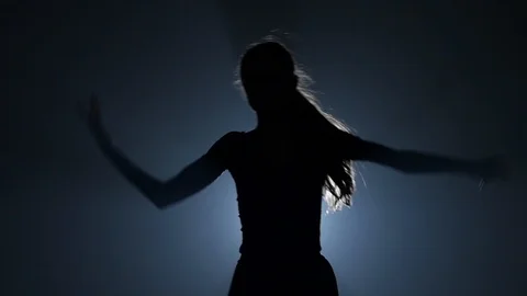 Close-up of attractive ballerina dancing elements of ballet. Slow motion. Stock Footage 111206617