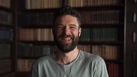 Close-up Of Attractive beard Man looking at The Camera. Smiling and Laughing Stock Footage 152567785