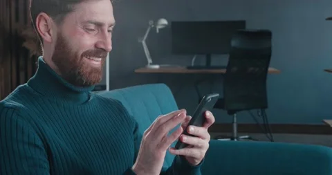 Close up of Attractive bearded Man is chatting in Social Networks, Dating Apps Stock Footage 136591710