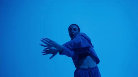 Close-up of attractive dancer on coloured changing neon background in studio Stock Footage 155891031