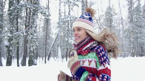 Close-up of an attractive fair-skinned young woman jogging in the winter forest Stock-Footage 71249463