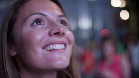 Close up of attractive female looking at an electronic display board in the city Video stock 67773310