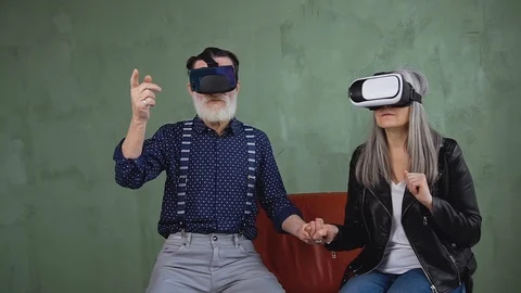 Close up of attractive high-spirited modern mature couple which sitting in the Stock Footage 125439468