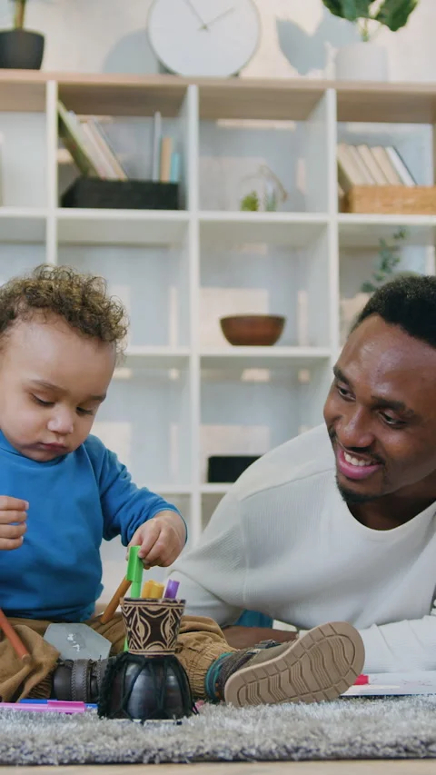 Close up of attractive joyful caring modern african american dad which relaxing  Stock Footage 329437378