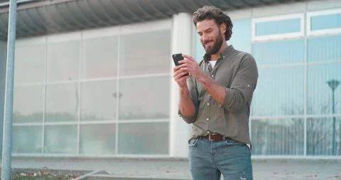 Close up of Attractive Man Using his Smartphone and Browsing on Social Media. Stock Footage 132994085