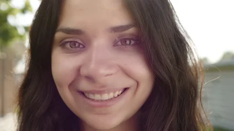 Close up of attractive young curly-haired brunette woman with swarthy skin Stock Footage 244377358
