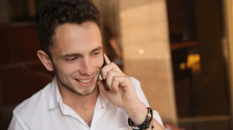 . Close-up of attractive young male speaking on cellphone Stock Footage 59796875