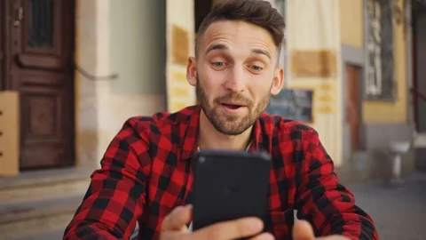 Close up attractive young man use phone sitting in cafe smile feel happy blurred Stock Footage 92069032