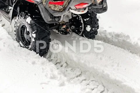 Close-up ATV 4wd quad bike in forest at winter. 4wd all-terreain vehicle stan Stock Photos