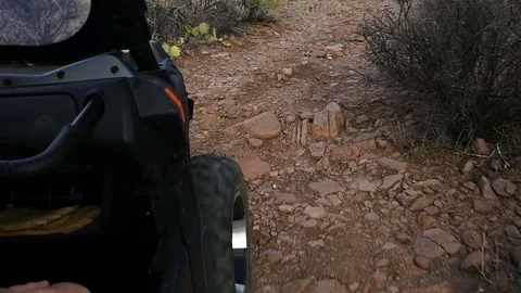 Close up of an ATV wheel while riding on a desert trail Stock Footage 76443519
