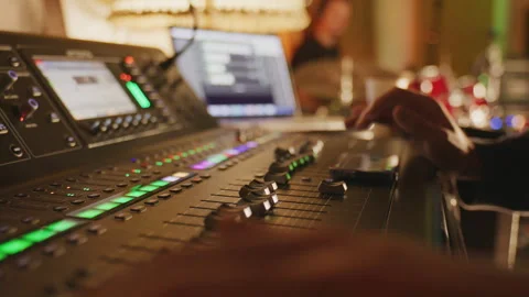 Close Up of Audio Engineer Adjusting Knobs on Professional Mixing Console Stock Footage 327285209
