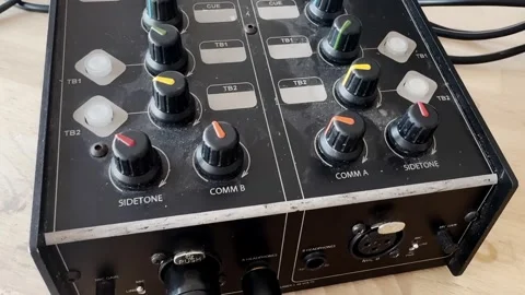 Close-up of an audio intercom control unit with colorful knobs, talkback Stock-Footage 337205992