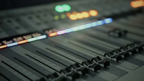 Close-up of audio mixing console with adjusting knobs and faders, mixer panel 動画素材 79123658