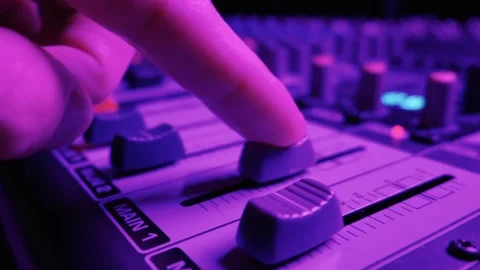 Close Up of Audio Mixing Console Channel Faders Under Blue Studio Lighting Vídeos de archivo 334739702