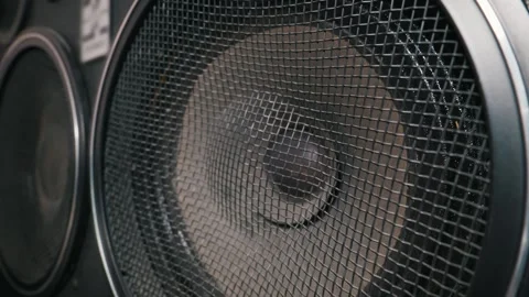 Close Up of an Audio Speaker Behind a Black Metal Mesh Grille Video stock 333827112