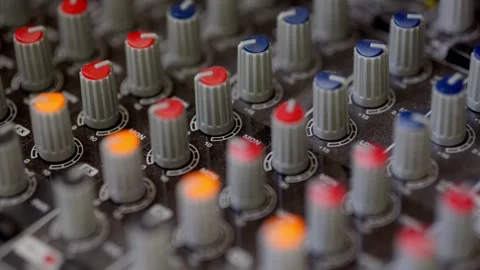 Close-Up of Audio Technician Moving Faders on Mixing Console Stock Footage 306960727