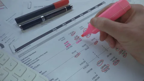 Close-up of auditor hands making notes on the financial report Stock Footage 167687988